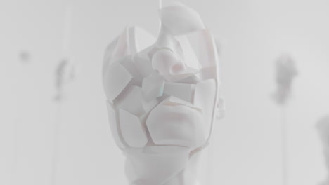 destroyed android head on spike in white space