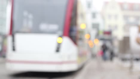 Blurry-people-moving-in-downtown-Erfurt,-historic-city-in-Germany