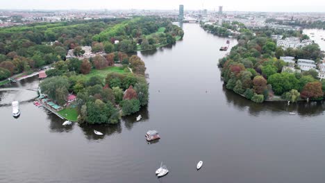 ascending over island with forested area river boats