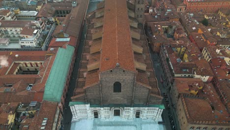 birds eye drone shot above basilica san petronio, piazza maggiore, bologna, italy