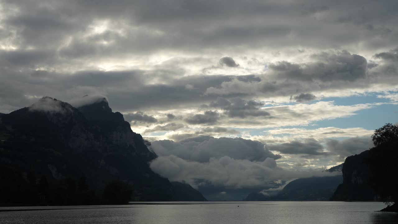 clouds drifting across mountains above Lake Walensee Switzerland