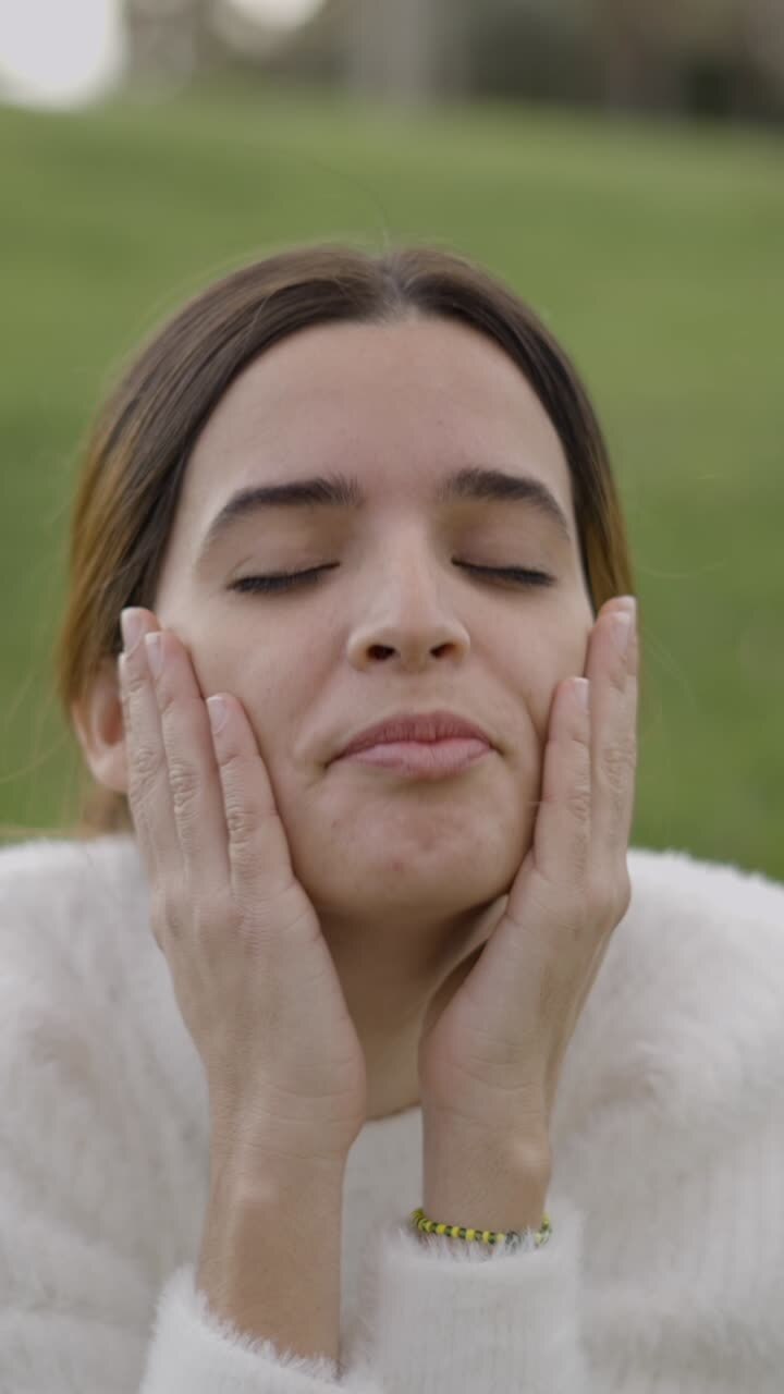 A woman's expressions and gestures with closed eyes