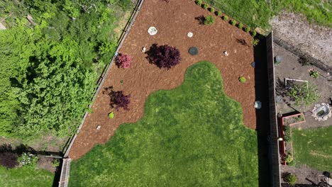 top down aerial shot of a yard with beautiful bark and landscaping