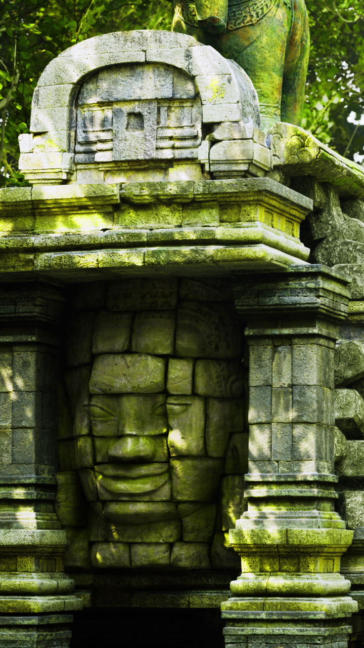 Ancient stone face hidden beneath layers of nature in serene surroundings