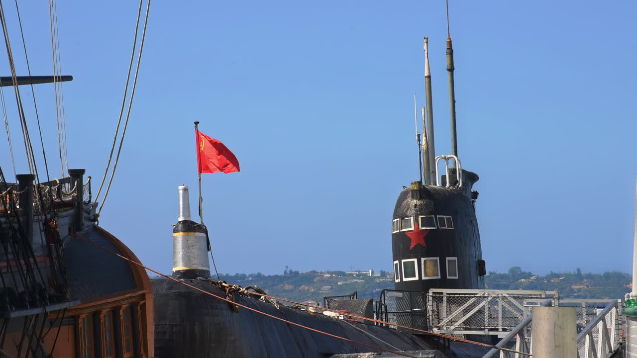 A submarine floating on the blue waves in a sunny day