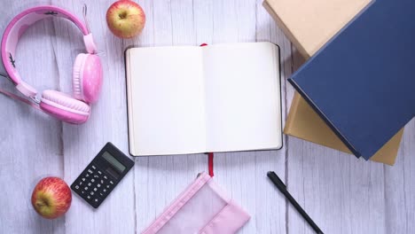 student supplies on a wooden desk