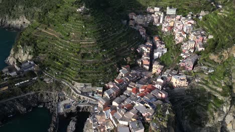 Manarola-Cinque-Terre-Italy-aerial-overhead-view-of-village-along-the-ocean