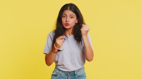 Aggressive-angry-Indian-woman-trying-to-fight-at-camera,-shaking-fist,-boxing,-punishment,-threaten