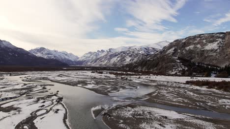 A-close-up-view-of-Rio-de-las-Vueltas,-captured-near-El-Chalten-on-a-snowy-autumn-day