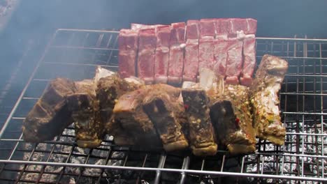 cooking lamb over the grill, braai