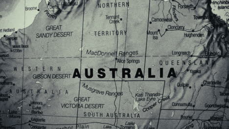 a detailed close-up of a map of australia, highlighting its states, territories, deserts, and major cities