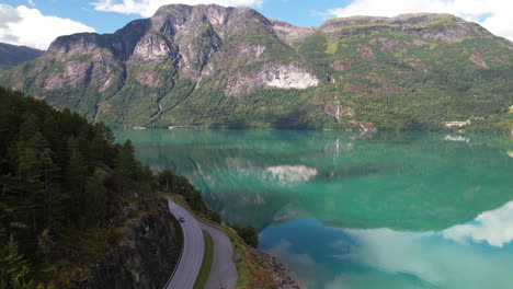 breathtaking lakeside view of oppstrynsvatn lake in norway surrounded by mountains, aerial view of norwegian scenery