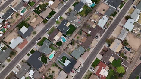 drone shot of residential neighborhood in suburbs of scottsdale, arizona usa, homes with pools and streets
