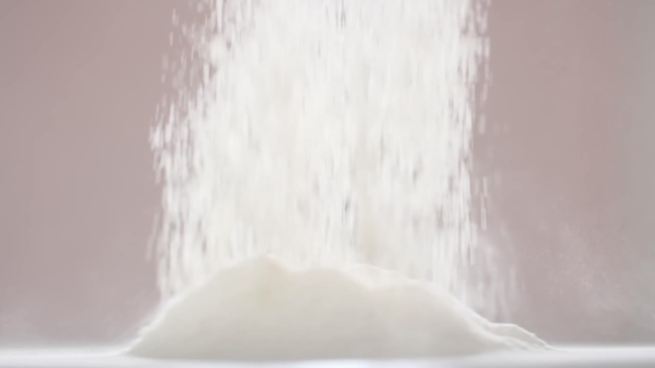 Flour pouring into pile