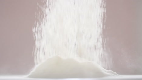 flour pouring into pile