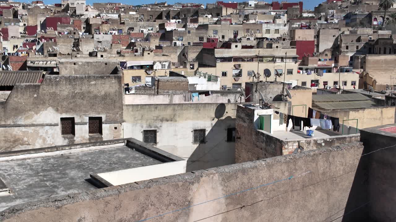 Overlooking the rooftops of Fes Medina with satellite dishes and drying laundry