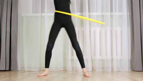 cropped partial view of girl training with hula hoop