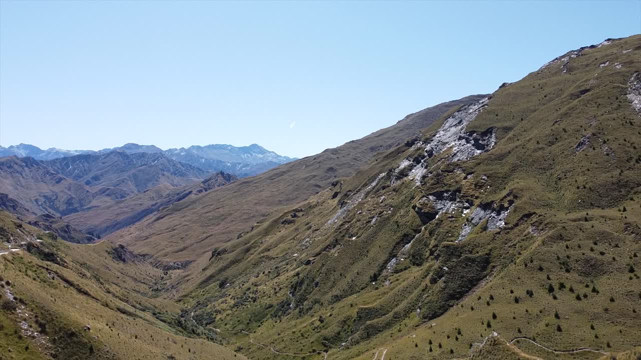 drone flying up showing the mountain and valley