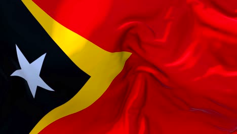 east timor flag waving in wind slow motion animation . 4k realistic fabric texture flag smooth blowing on a windy day continuous seamless loop background.