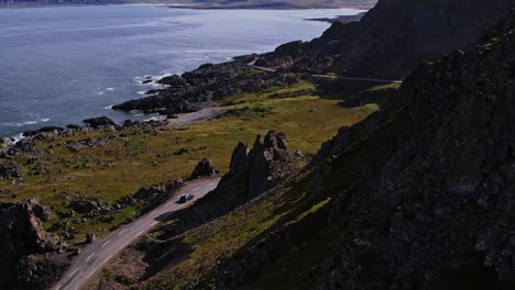 Aerial-car-driving-in-rocky-scenery-Finnmark-Norway