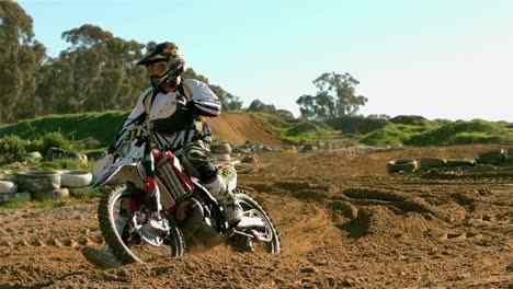 man riding a motor cross bike