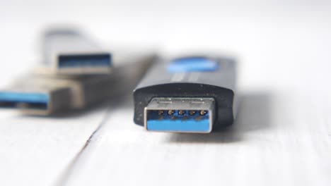 close-up of usb drives on a white surface