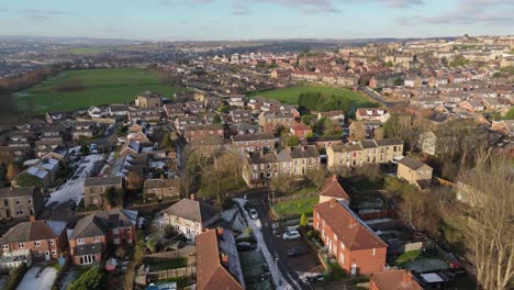 Drone's-eye-winter-view-captures-Dewsbury-Moore-Council-estate's-typical-UK-urban-council-owned-housing-development-with-red-brick-terraced-homes-and-the-industrial-Yorkshire