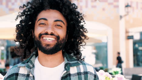 happy man with curly hair