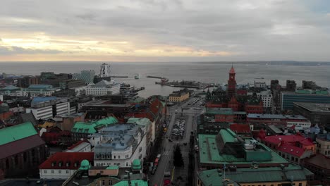 Aerial-rising-over-picturesque-city-of-Helsingborg-on-cloudy-day,-Sweden