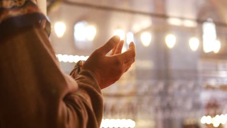 praying hands in a mosque