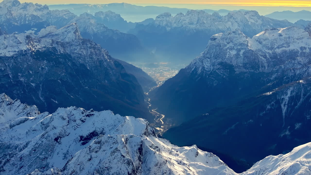 Aerial drone view of the Marmolada mountain in the Dolomites, northeastern Italy with the blue sky on the background