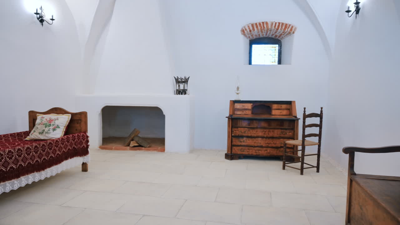 HUNEDOARA, ROMANIA - MAY 22, 2023: View of the Corvin Castle interior, Hunedoara, Romania. Living room with wooden furniture
