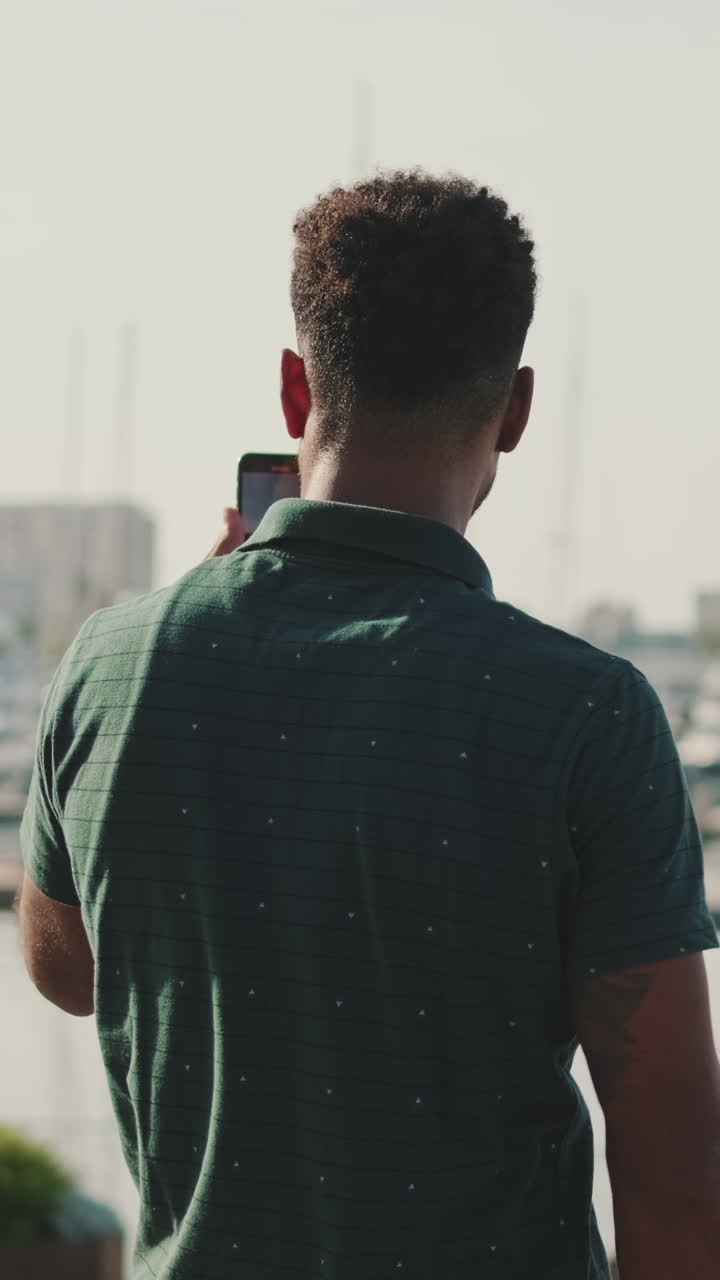 Man taking photo of harbor