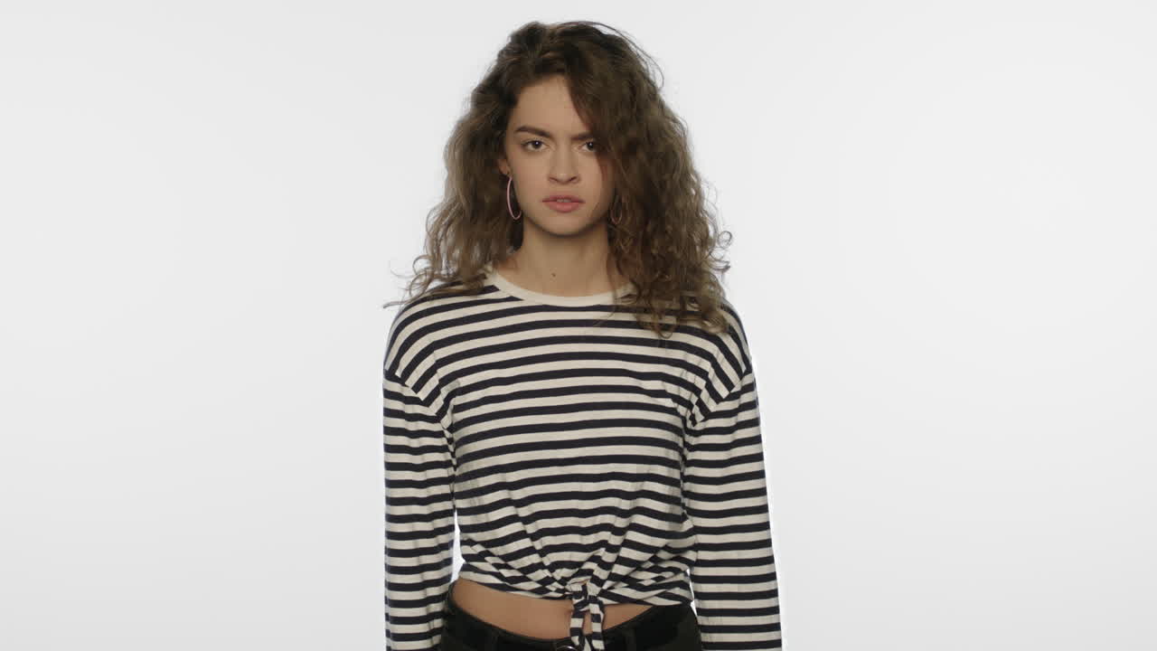 Angry woman screaming on white background. Angry girl scream in studio