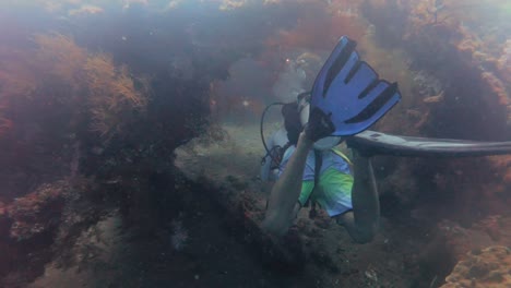 pov scuba diver sunken ship wreck uss liberty scuba diving in bali indonesia