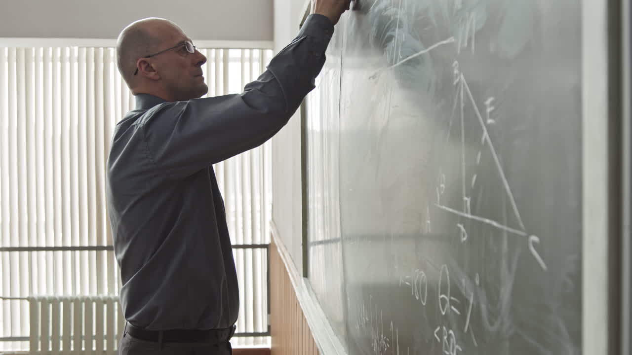 University Professor of Mathematics Writing on Blackboard