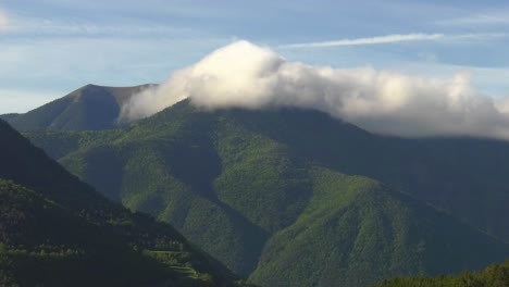 Clouds-moving-over-forested-mountains,-spain