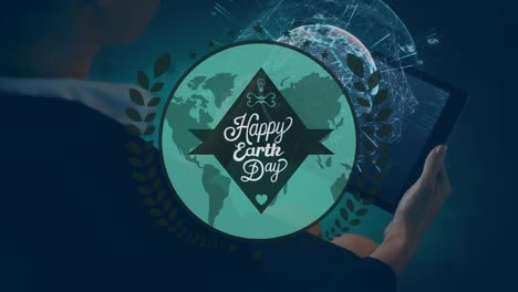 animation of happy earth day over hands of caucasian man using tablet