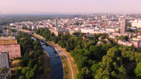 Ostrava-new-city-hall-aerial-shot-reveal-city-beside-Ostravice-river-on-Moravia-Silesia-border,-Czech-republic