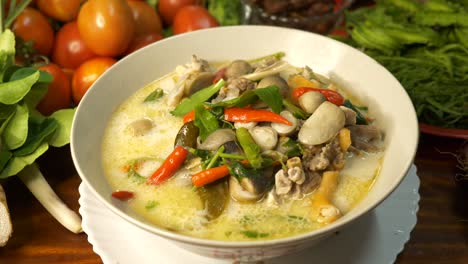 tasting delicious traditional soup of thailand named tom kha kai