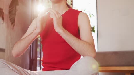 Caucasian-non-binary-transgender-woman-practicing-yoga,-meditating