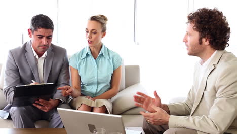 Business-people-working-together-on-sofa