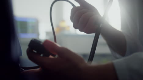 Physician-hands-measure-blood-pressure-with-tonometer-unknown-patient-close-up.