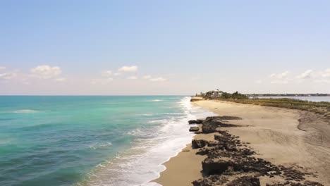 jensen hutchinson island coast line turquoise water alone the shoreline, drone view