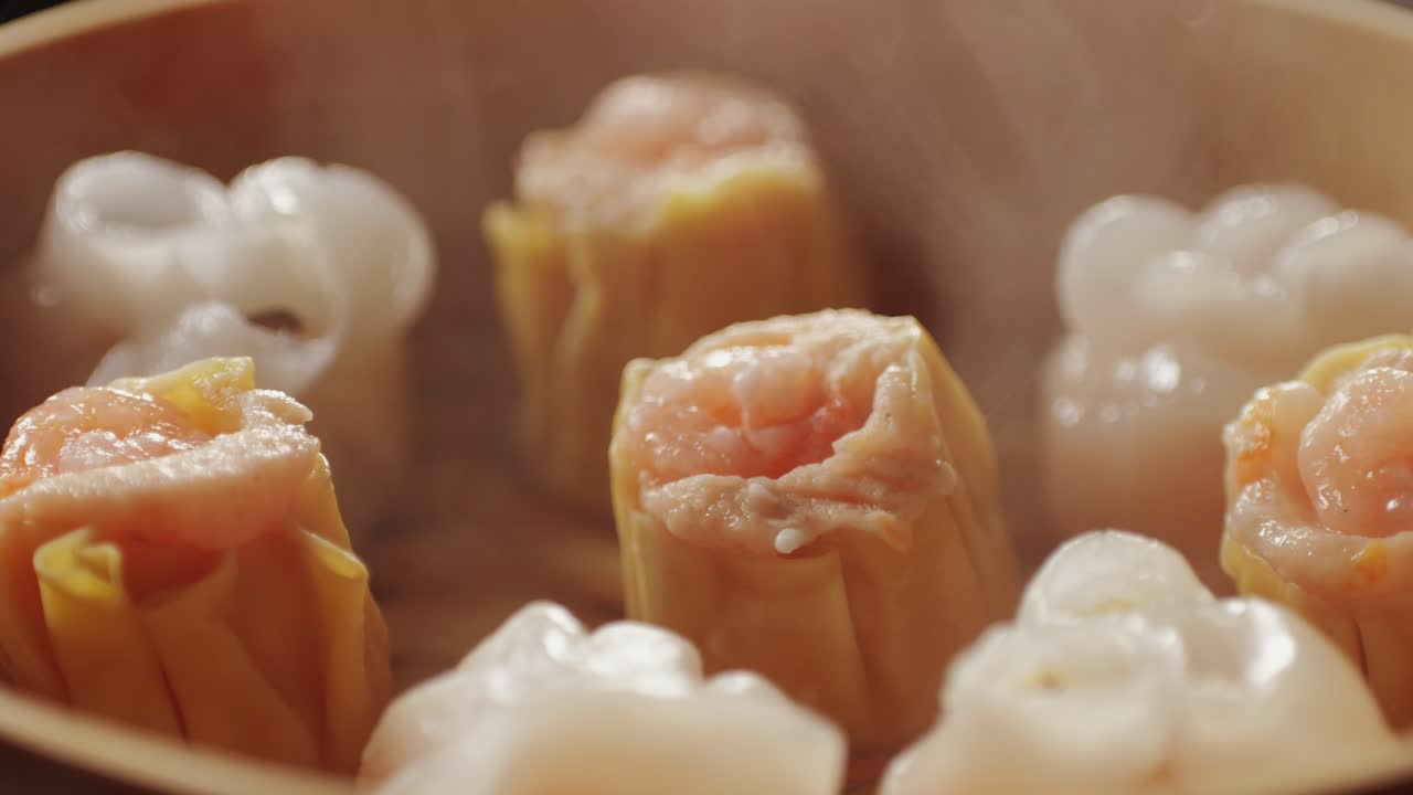 Various of dim sum on wooden steamer close-up macro. Steaming Technique. Chinese dessert food. Dimsum with shrimps, fish and meat. Dish in a cafe. Homade. Delivery