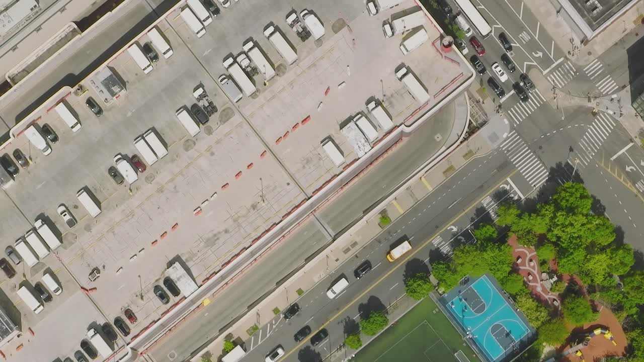 Aerial view of a parking lot, road, and city street