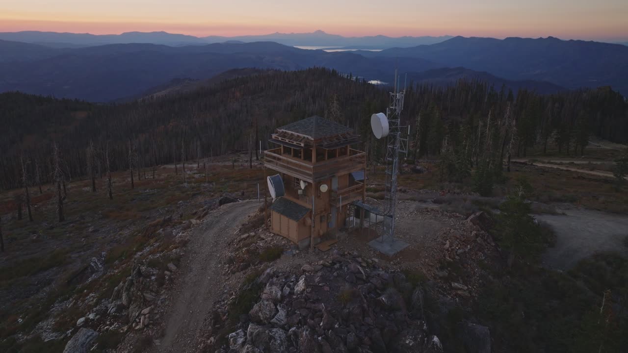 Drone view of fire lookout tower in serene Californian sunset