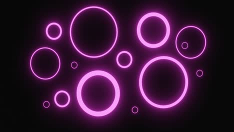 anillos de neón rosados pulsantes de varios tamaños que brillan sobre un fondo negro y se inclinan