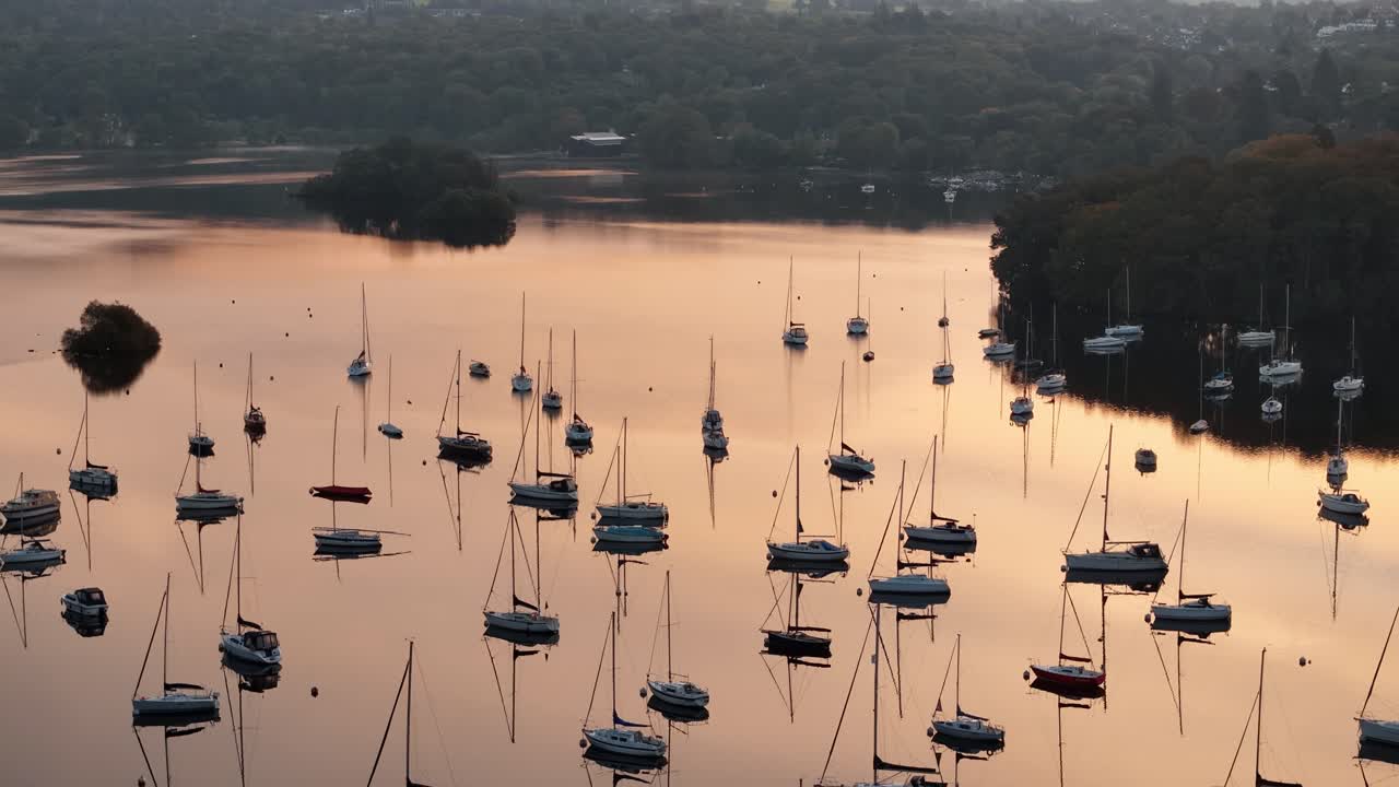 Stunning Sunset over Lake with Sailboats