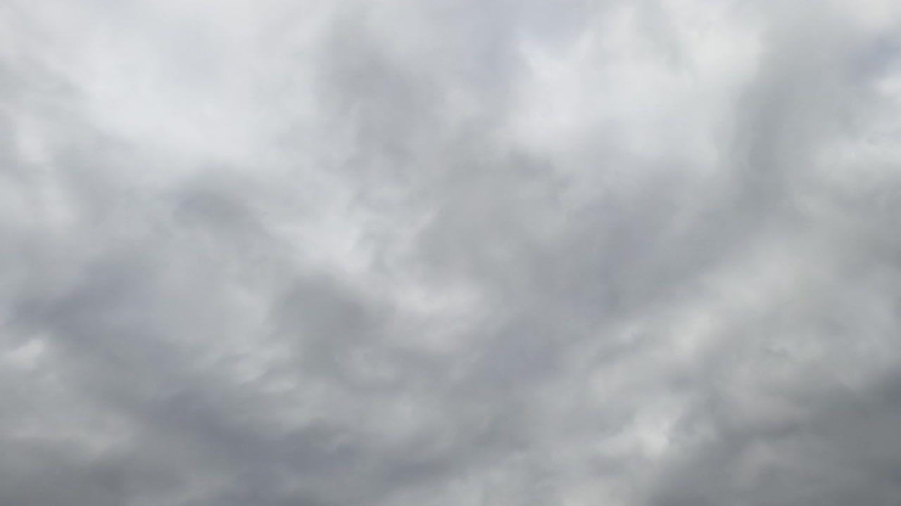 Dramatic cloudscape forming in the skies. Rainy clouds move in the atmosphere. Low angle view. Timelapse.